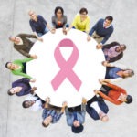 Multiethnic People Holding Hands for Breast Cancer Foundation