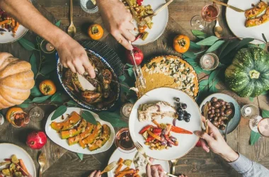 Flatlay Of Friends Feasting At Thanksgiving Day Table With Turkey Picture Id1063025552 Copy