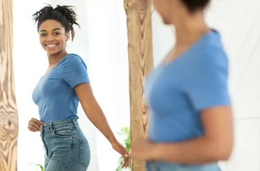 Joyful African American Girl After Slimming Looking In Mirror Indoor Picture Id1273277150