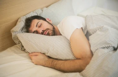Person Sleeping In A Bed