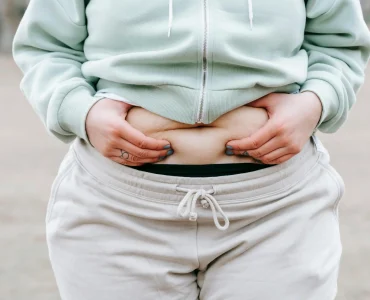 Woman Holding Her Belly Fat