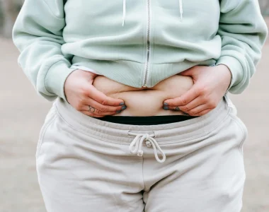 Woman Holding Her Belly Fat