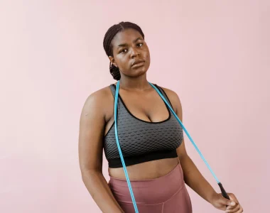 Woman In Gym Attire Holding A Jump Rope