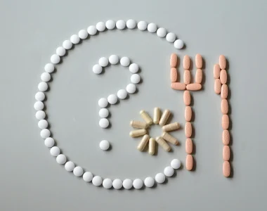 A Plate And Cutlery Made Out Of Pills With A Question Mark Inside