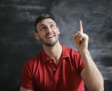 Man Pointing In The Air Thinking